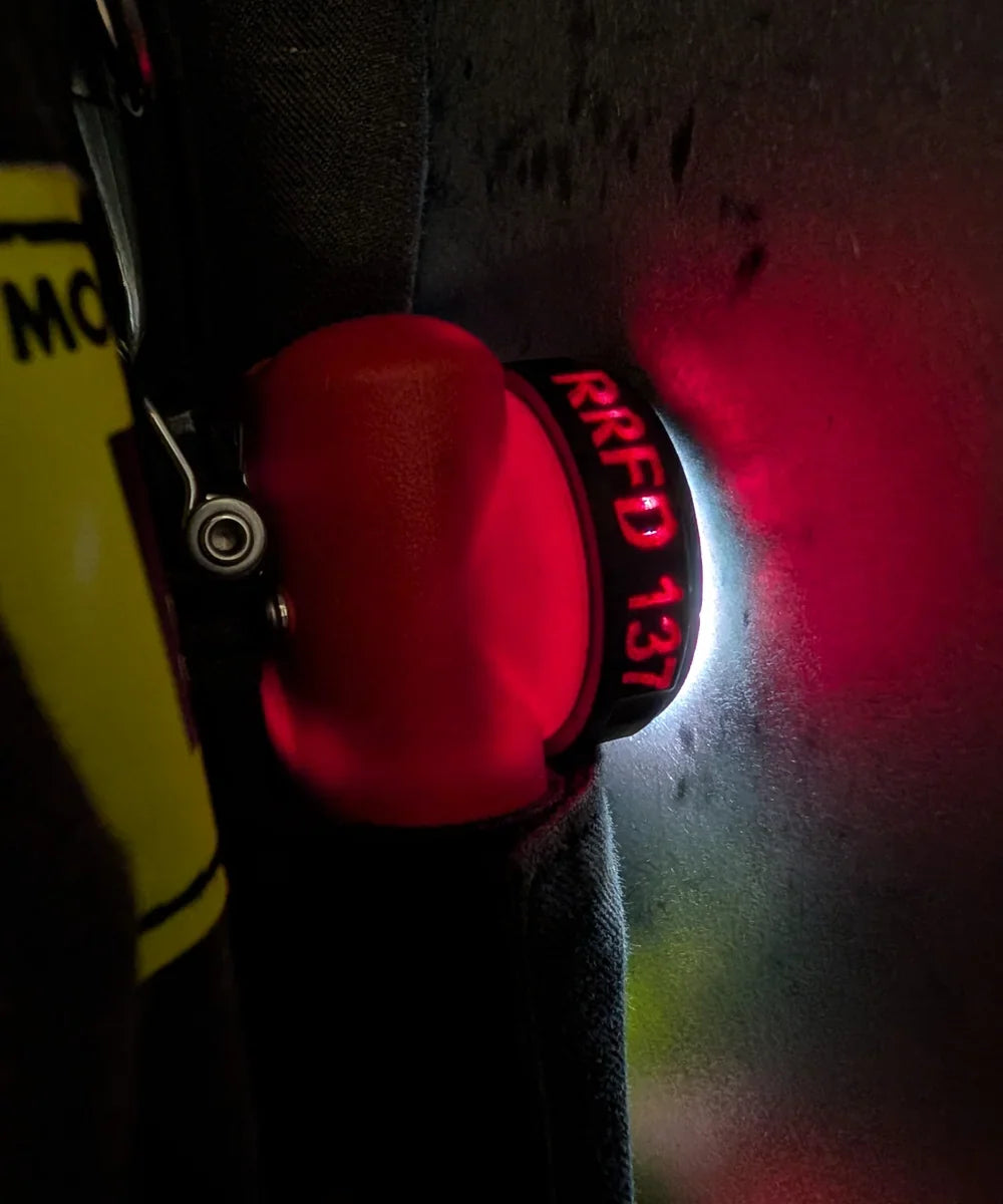 Illuminated personalized firefighter flashlight identification bezel