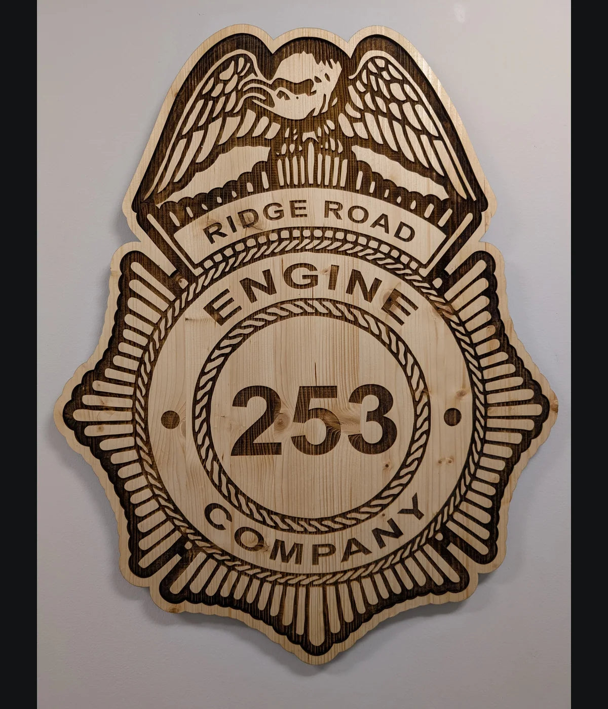 Large laser-engraved wooden firefighter badge wall plaque, front view