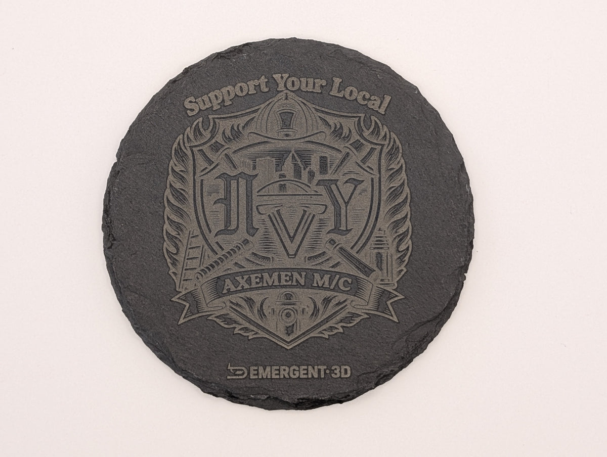 Close-up of a round polyurethane-finished laser engraved slate coaster with detailed firefighter artwork