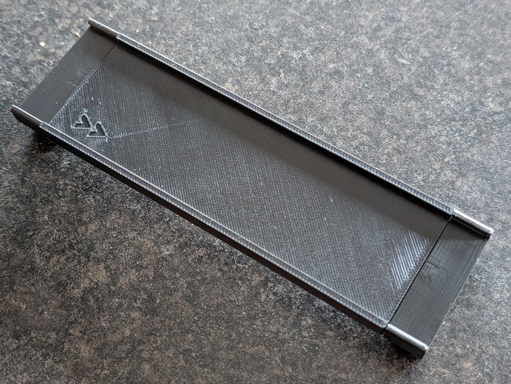 Black nameplate mount for a ReadyRack firefighter gear rack