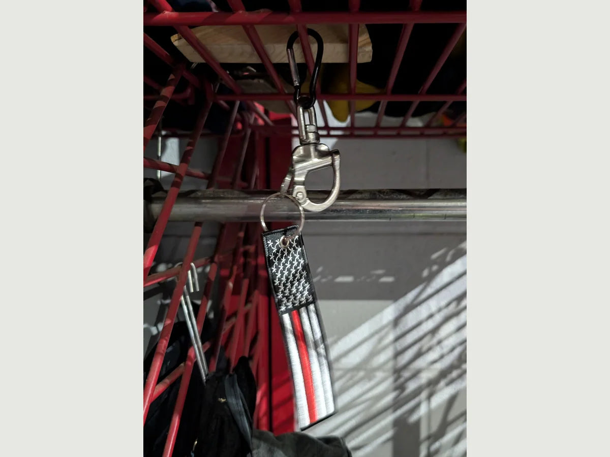 SCBA facepiece quick-release retention system installed on firefighter gear